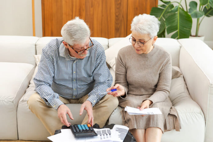senior citizen checking on their savings accounts