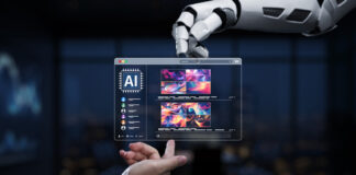 A futuristic robot hand engages with a digital screen showcasing vibrant abstract art in a sleek modern office setting, highlighting innovation and creativity.