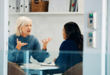 Using Employee Feedback to Help Improve Your Benefits Strategy employee giving feedback to the CEO