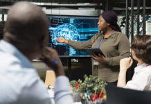 Leaders Can No Longer Fake An AI Strategy leaders using technology in the office. AI strategy concept
