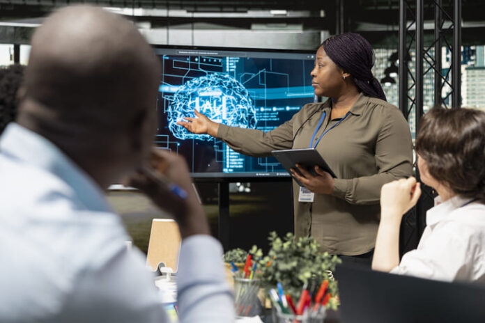 iStock-2263885519 (1) leaders using technology in the office. AI strategy concept