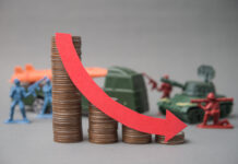 Red falling down red graph and stack coins with soldier fights, weapon war background. The global economic impact of the war, recession, energy crisis, oil price hike supply shortage and Effect of Iran war.