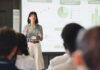 Presentation, screen and businesswoman in office for planning with finance graph, statistics or charts. Meeting, speech and female financial manager with information for investment pitch in workplace