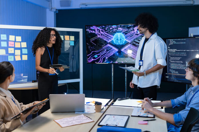 iStock-2275448215 (1) Employees using AI in the workplace