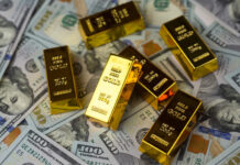 Why Gold IRAs are Worth Your Attention Gold bars, dollars. Gold IRAs on US dollar banknotes