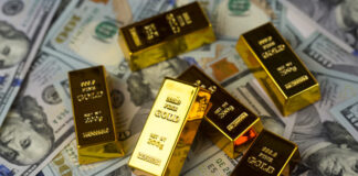 Gold bars, dollars. Gold IRAs on US dollar banknotes