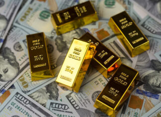 Why Gold IRAs are Worth Your Attention Gold bars, dollars. Gold IRAs on US dollar banknotes