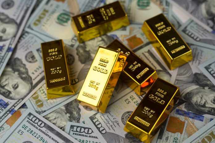 iStock-2267393170 (1) Gold bars, dollars. Gold IRAs on US dollar banknotes