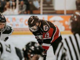 Person playing hockey - NHL’s CFTC Deal Shows Sports Integrity