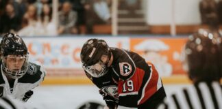 Person playing hockey - NHL’s CFTC Deal Shows Sports Integrity