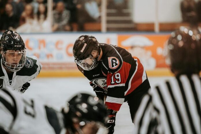 Person playing hockey - NHL’s CFTC Deal Shows Sports Integrity