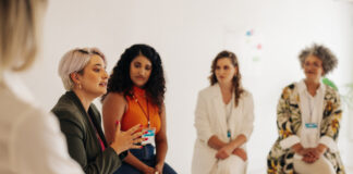 Confident businesswomen having a discussion during a conference meeting. Group of multicultural businesswomen sharing ideas while working together in an all-female startup.