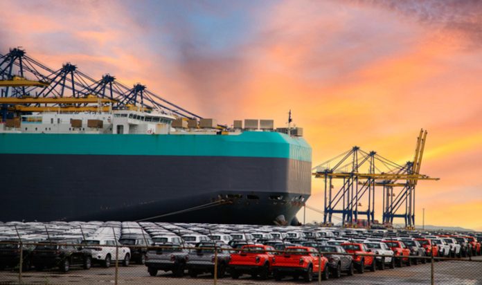 Close up vehicle carrier vessel loading car for shipping to worldwide, Large RoRo (Roll on off) vehicle car carrier, New car lined up in the port for import export around the world. Car Shipping