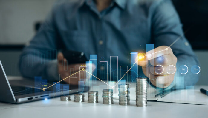 Saving money concept.Stack of coins with trading price graph growth.Money business financial graph diagram of coin. Financial growth data or investment market profit bar and success report. Financial Visibility in Business Growth