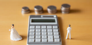 Couple in troubles in connection with divorce, marriage and family. Retirement Asset. Concept of couple's money troubles with calculator and ring.