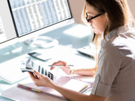 Woman doing accounting for Outsourced Bookkeeping services