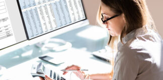 Woman doing accounting for Outsourced Bookkeeping services