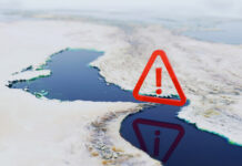 Strategic Alert, map of the Strait of Hormuz featuring a large red warning icon.