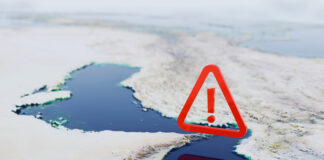 Strategic Alert, map of the Strait of Hormuz featuring a large red warning icon.