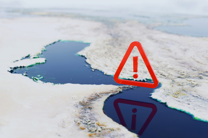 Strategic Alert, map of the Strait of Hormuz featuring a large red warning icon. Conceptual representation of geopolitical tension, maritime security risks, and potential trade blockades in Iran. Strategic Alert, map of the Strait of Hormuz featuring a large red warning icon.