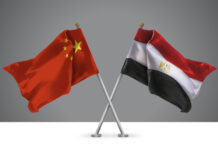 The Xi-Sisi Meeting: Why It Matters 3D illustration of Two Wavy Crossed Flags of China and Egypt, Sign of Chinese and Egyptian Relationships