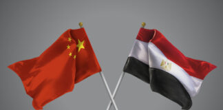 The Xi-Sisi Meeting: Why It Matters 3D illustration of Two Wavy Crossed Flags of China and Egypt, Sign of Chinese and Egyptian Relationships