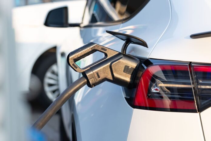 iStock-2269175136 (1) New York EV Rollout - EV car at charging station