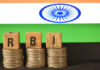 How RBI Repo Rate Changes Flow Through to Your MSME Loan Interest A closeup selective focus picture of a letters of RBI Repo Rate against the background of Indian Flag