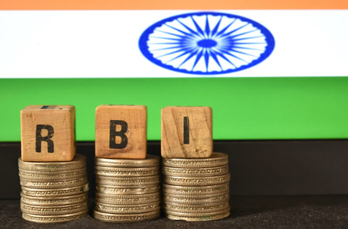 A closeup selective focus picture of a letters of RBI A closeup selective focus picture of a letters of RBI Repo Rate against the background of Indian Flag