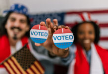 voting in the U.S., wearing American flag caps and showing happiness and civic pride while watching the elections.