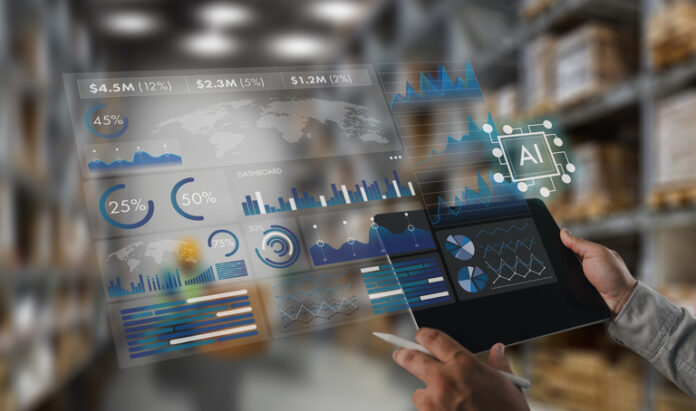 AI-powered business analytics dashboard above a tablet in a warehouse, displaying real-time inventory, logistics, supply chain metrics, data visualization, and automation insights. AI-Powered Workforce